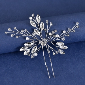 Handmade bridal hair pin with pearls and marquise crystals on elegant blue background