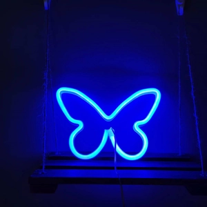 Blue butterfly LED neon sign on a rustic wooden swing shelf for wall decoration