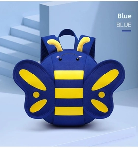 Detailed view of blue bee-shaped kids backpack with yellow stripes on geometric stairs