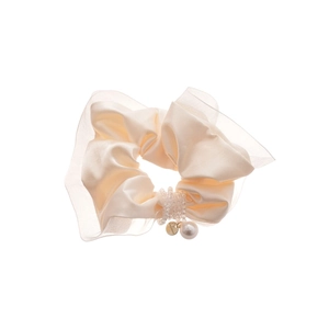 Elegant cream satin and mesh scrunchie with pearl charm and golden pendant on white background