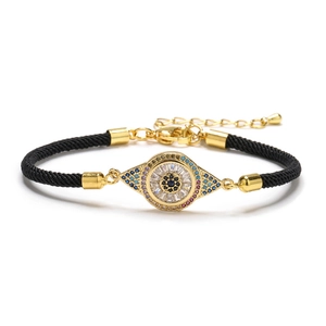 Bracelet œil maléfique plaqué or avec zircons colorés et cordon tressé noir