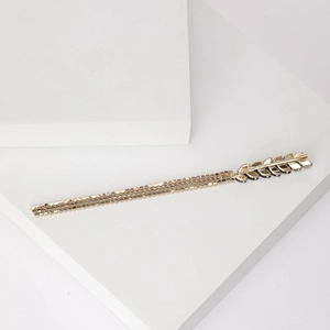 Elegant gold metal wheat ear brooch with sparkling tassels and deep blue crystal accents