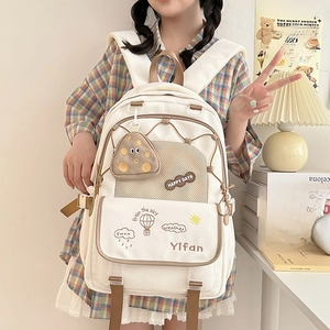 Lightweight cream canvas school backpack with multiple pockets for junior students