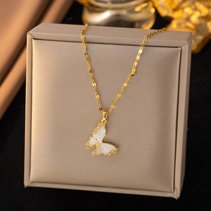 Elegant gold butterfly pendant necklace with white shell inlay and sparkling zircons
