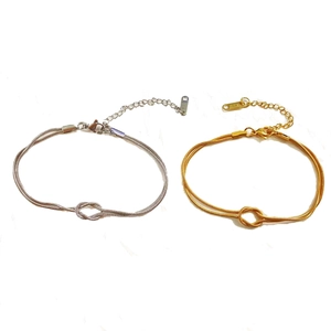 Intertwined knot double snake chain bracelet in gold and silver stainless steel