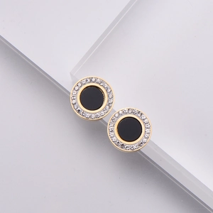 Elegant gold titanium steel round studs with black inlay and zircon crystals border