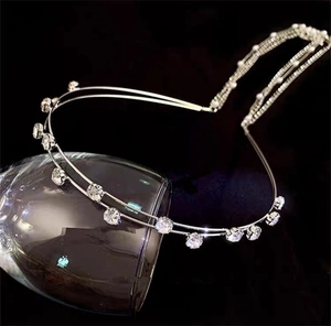Detail of silver double-layered headband with sparkling rhinestones and delicate beads