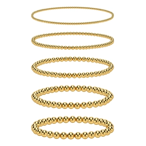 Five-piece set of polished gold stainless steel bead bracelets in varying bead sizes