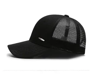 Side view of breathable black mesh baseball cap with metal logo and curved brim