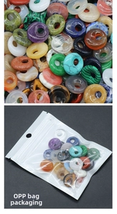 Macro shot of assorted gemstone donut beads and clear OPP bag packaging detail