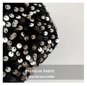 Macro shot of high-quality black fabric with dense shiny silver sequins on tote bag