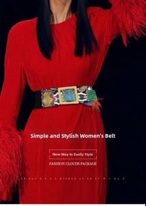 Detail of wide stretch belt with green snakeskin print and gold metal buckle on red dress