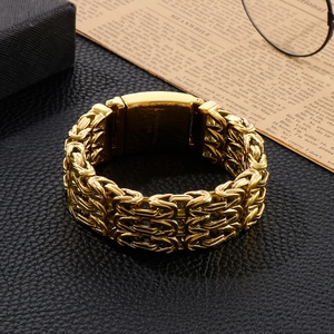 Detail of gold Byzantine weave bracelet with 316L stainless steel engraving on the clasp