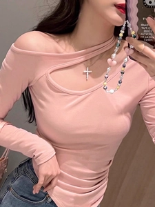 Detailed shot of a pink off-shoulder long sleeve top with cutout design for women