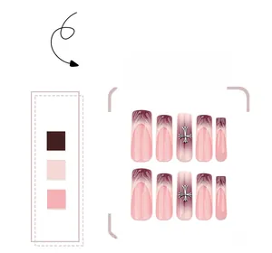 Detailed view of burgundy gradient press-on nails featuring silver metal cross charms