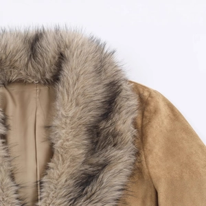 Brown suede jacket with fluffy faux fur collar shown in a high-quality close-up detail