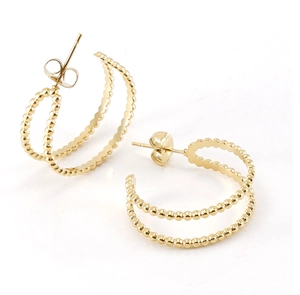 Detailed close-up of 18K gold-plated beaded hoop earrings with high-polish metallic finish