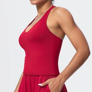 Detail view of red V-neck sports bra with wide straps and high-stretch seamless fabric