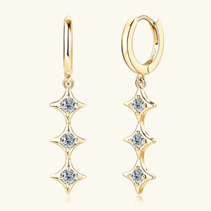 Detail of gold three-star drop earrings with sparkling moissanite stones in S925 silver