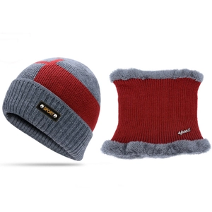 Close-up of red and grey knitted hat and neck warmer set with warm fleece lining