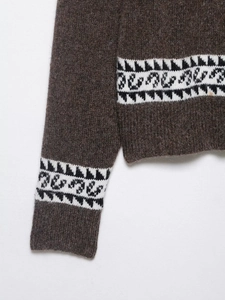 Close-up of brown mohair knit cardigan featuring Nordic geometric jacquard pattern details