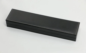 Detail view of black PU leather rectangular jewelry box with white hand-stitching texture