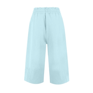 Close-up of elastic waistband and breathable linen texture on light blue wide leg pants