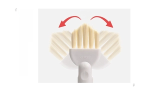 Detail of multi-functional cleaning brush showing 90-degree rotating head for gap cleaning