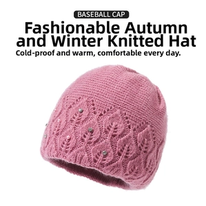 Close-up of pink knit hat featuring hollow leaf patterns, faux pearls and sparkling rhinestones