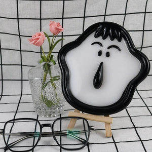 Detail of cartoon face silicone tray mold showing wavy hair and surprised expression