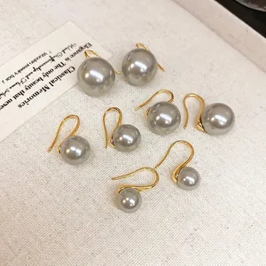 Elegant 18K gold-plated vintage gray pearl drop earrings on minimalist white background