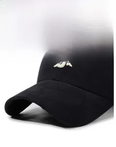 Close-up of white 3D letter embroidery on black cotton baseball cap with stiff brim