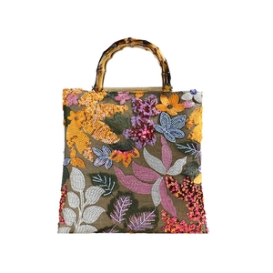Floral embroidery linen handbag with bamboo handles and sequin details for women