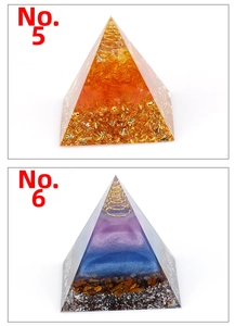 Detailed view of Orgonite pyramids with metal coils and natural crystals for energy healing