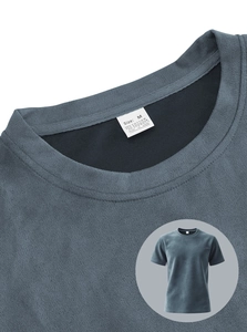 Detail of blue knitted T-shirt collar with size label and high-quality fabric texture