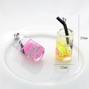 Miniature resin fruit drink pendants in dragon fruit and lime styles, 25mm height