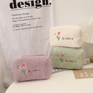Plush tulip makeup bags in white, green, and purple colors with sunshine embroidery