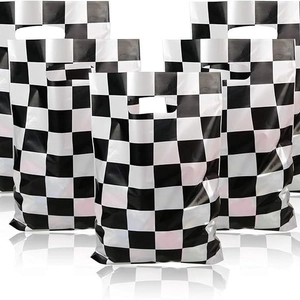 Checkered black and white plastic gift bags with die-cut handles for party favors