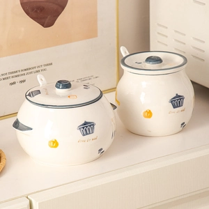 Ceramic seasoning jar set with lids and spoons featuring Love to eat print design