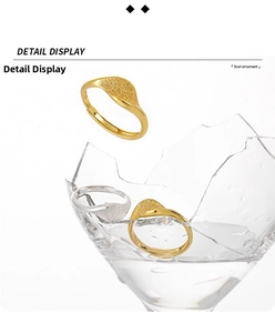 Detail view of irregular wave frosted S925 silver rings with golden and silver finishes