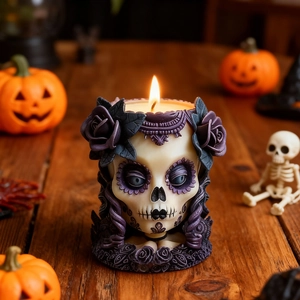 Creative Halloween skull candle mold with purple rose floral details on wooden table