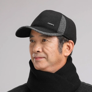 Detail of wool fabric winter baseball cap for men with sport metal logo and ear protection