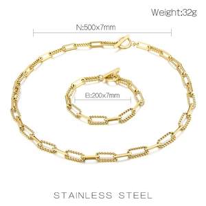 Detail view of gold stainless steel necklace and bracelet set with size specifications