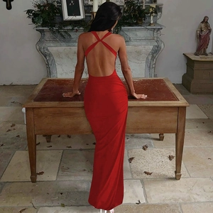 Detail of red backless satin gown with ruched side and elegant floor length style
