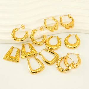Set of multiple gold-finish stainless steel earrings in various geometric and twisted designs