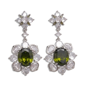 Silver flower earrings with green oval zircon and white petal gems on white background