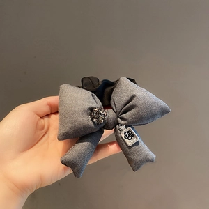 Elegant grey fabric bow hair tie with rhinestone buckle and camellia perfume charm