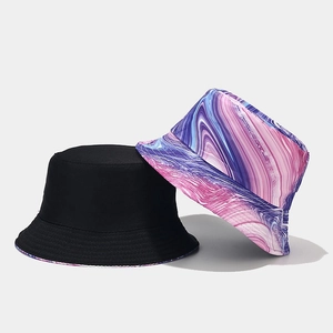 Double-sided reversible bucket hat with colorful graffiti print and solid black design