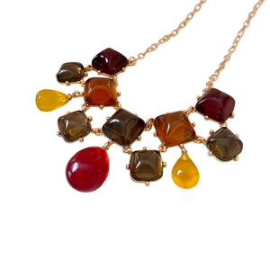 Vintage style square resin pendant necklace featuring amber and red gemstone accents