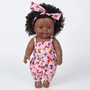 Close-up of 12-inch African American baby doll with curly hair and pink butterfly outfit